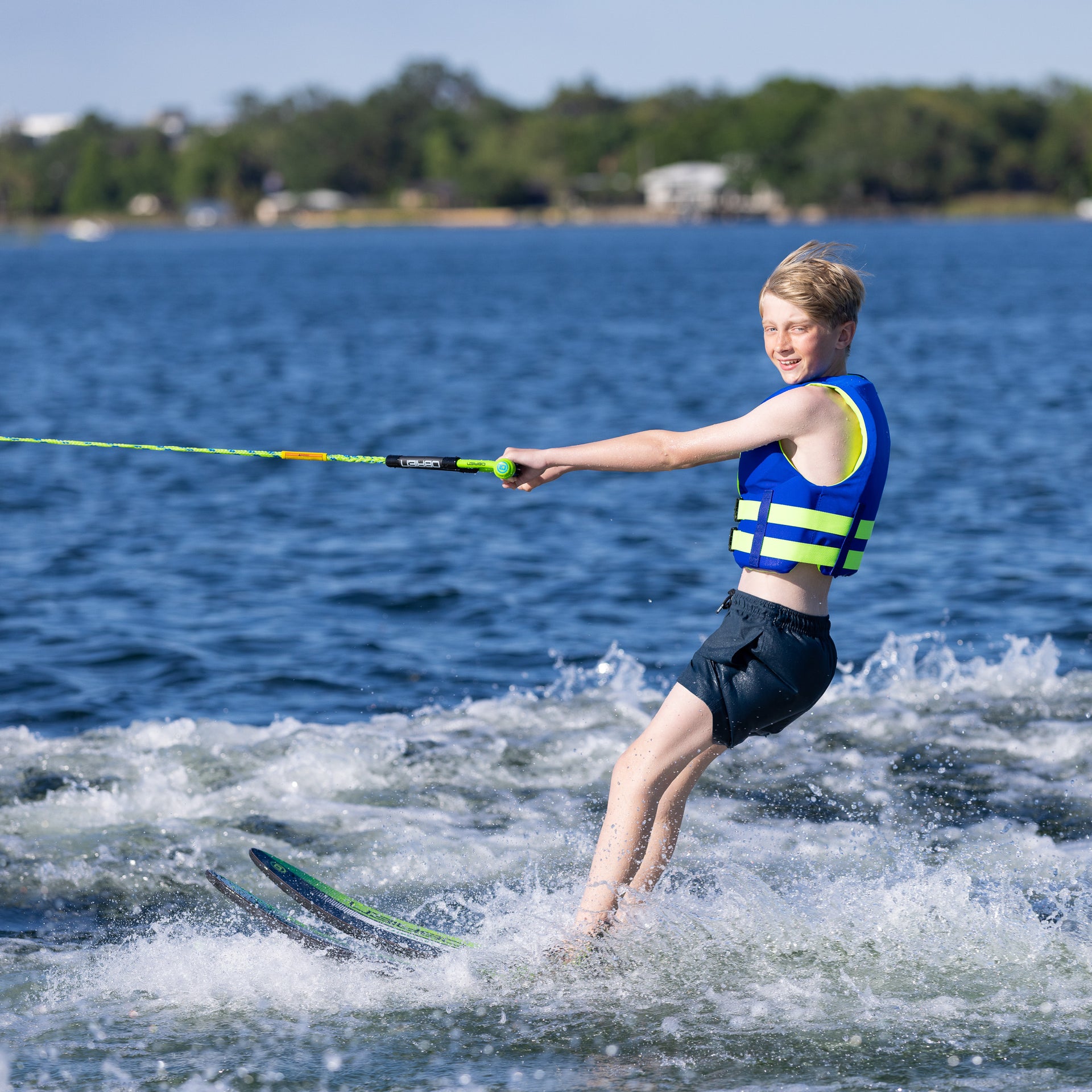 boy waterskiing on a lake