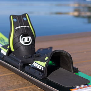 Close-up of a water ski with a OBrien logo on a wooden dock.